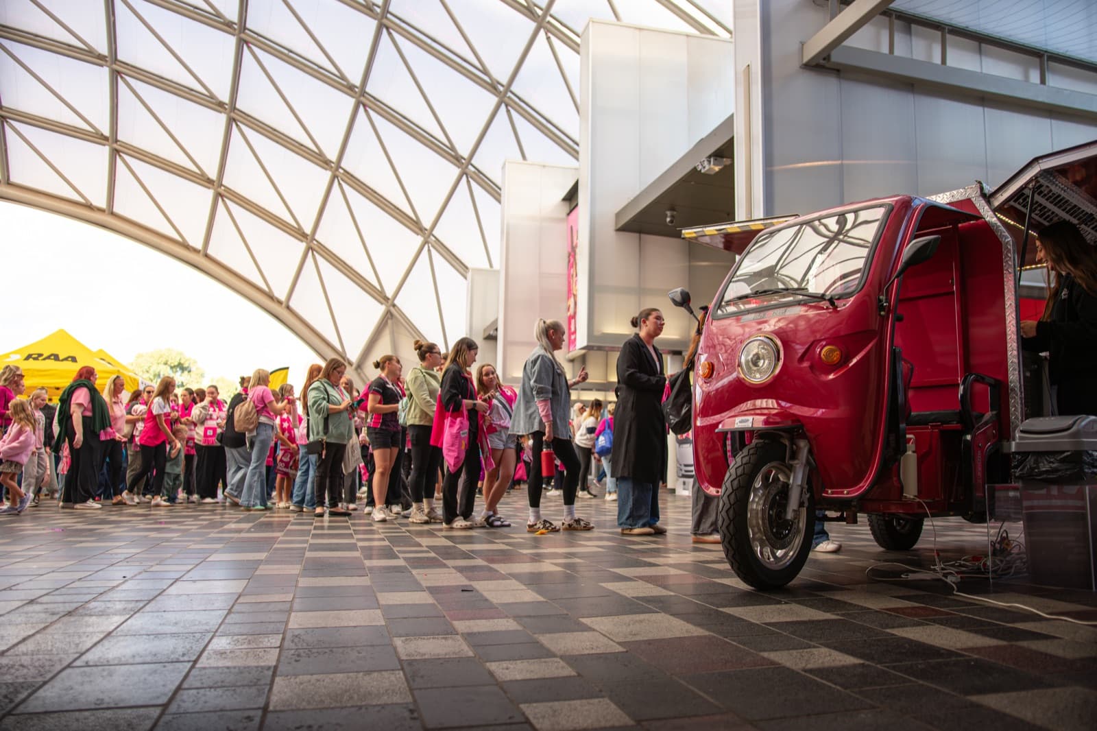 Wide crowd surrounding the Chocolate Boys tuk-tuk